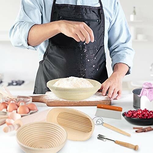 Person sprinkling flour over dough with baking tools and ingredients.