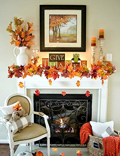 Cozy fireplace decorated with fall leaves and 'Give Thanks' sign.