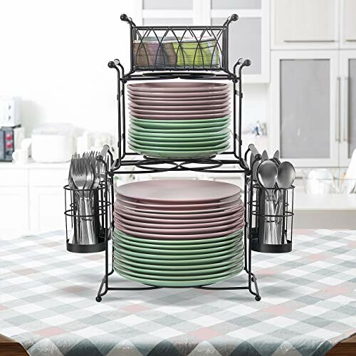 Double-tier dish rack with plates and utensils on a kitchen table