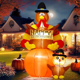 Inflatable Thanksgiving turkey and chick decoration in front of a house.